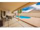 Backyard with covered patio and pool, offering a private and inviting outdoor space at 9859 W Irma Ln, Peoria, AZ 85382