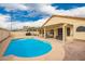 Backyard pool and covered patio, perfect for enjoying sunny days and outdoor entertainment at 9859 W Irma Ln, Peoria, AZ 85382