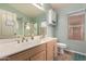 Bathroom featuring double sinks with a shower and toilet at 9859 W Irma Ln, Peoria, AZ 85382