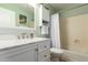 Bathroom with a white vanity and bathtub at 9859 W Irma Ln, Peoria, AZ 85382