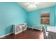 Cozy bedroom with modern furniture, a ceiling fan and window at 9859 W Irma Ln, Peoria, AZ 85382