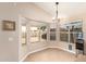 Bright breakfast nook featuring large windows with backyard views and tile flooring at 9859 W Irma Ln, Peoria, AZ 85382