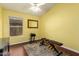 Home gym with hardwood floors, weights and ceiling fan at 9859 W Irma Ln, Peoria, AZ 85382
