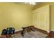 Home gym features weights, mirror and a yellow wall at 9859 W Irma Ln, Peoria, AZ 85382