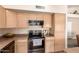 Kitchen featuring stainless steel appliances and ample cabinet space for optimal storage at 9859 W Irma Ln, Peoria, AZ 85382