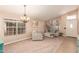 Inviting living room with carpet, large windows, and elegant decor at 9859 W Irma Ln, Peoria, AZ 85382
