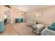 Cozy living room with carpet, neutral walls, and a decorative chandelier at 9859 W Irma Ln, Peoria, AZ 85382