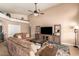 Comfortable living room featuring a ceiling fan and neutral decor at 9859 W Irma Ln, Peoria, AZ 85382