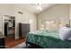 Inviting main bedroom featuring a ceiling fan, a bay window, and an en suite bathroom at 9859 W Irma Ln, Peoria, AZ 85382