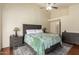 Main bedroom featuring a tray ceiling, accent lighting, and elegant furnishings at 9859 W Irma Ln, Peoria, AZ 85382