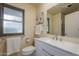 Clean bathroom with a white vanity and a well-lit mirror, perfect for a fresh start to your day at 9862 N Balboa Dr, Sun City, AZ 85351