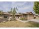 Charming single-story home featuring desert landscaping, a quaint courtyard, and a two-car garage at 9862 N Balboa Dr, Sun City, AZ 85351