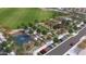 Aerial view of the community park, with basketball courts, garden, parking, and manicured green space at 9965 W Flower St, Avondale, AZ 85392
