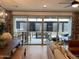 Open concept living room with an adjacent dining area, and a view of the outdoor seating at 9965 W Flower St, Avondale, AZ 85392