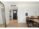 Bright dining area showcasing hardwood floors and a black accent door at 1011 E Cavalier Dr, Phoenix, AZ 85014