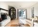 Open-concept living area with a fireplace, cabinet, and sliding glass doors leading to outdoor spaces at 1011 E Cavalier Dr, Phoenix, AZ 85014