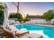 Inviting pool area with lounge chairs and a tranquil ambiance, perfect for outdoor gatherings at 1011 E Cavalier Dr, Phoenix, AZ 85014