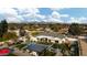 Stunning aerial view of the property showing the pool, playground, sport court and beautifully landscaped backyard at 10242 N 57Th St, Paradise Valley, AZ 85253