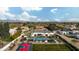 Scenic aerial view showcasing the home's backyard oasis, complete with pool, sport court, and mountain views at 10242 N 57Th St, Paradise Valley, AZ 85253