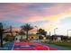 Private basketball court and outdoor living area with a custom outdoor kitchen and landscaping at 10242 N 57Th St, Paradise Valley, AZ 85253