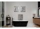 Elegant bathroom featuring a freestanding soaking tub, modern fixtures, and tasteful decor at 10242 N 57Th St, Paradise Valley, AZ 85253