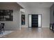 Bright foyer with wood floors, modern front door, and artwork at 10242 N 57Th St, Paradise Valley, AZ 85253