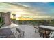 Outdoor patio with a built in kitchen island and majestic desert and mountain views at 10322 E Breathless Ave, Gold Canyon, AZ 85118