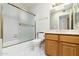 Bathroom with marble floors, a shower and wood cabinets at 10322 E Breathless Ave, Gold Canyon, AZ 85118