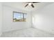 Bright bedroom with white marble floors and an expansive window offering scenic mountain views at 10322 E Breathless Ave, Gold Canyon, AZ 85118