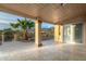 Covered patio with mountain views, travertine tile, and access to the interior at 10322 E Breathless Ave, Gold Canyon, AZ 85118