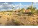 Exterior view of the home showcasing desert landscaping and well maintained yard at 10322 E Breathless Ave, Gold Canyon, AZ 85118