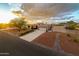 Aerial shot of home with desert landscaping, a long driveway, and mountain views at 10322 E Breathless Ave, Gold Canyon, AZ 85118