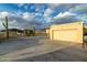 Long driveway leading to garage with a detached carport at 10322 E Breathless Ave, Gold Canyon, AZ 85118