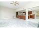 Open-concept living room with an open kitchen and marble flooring at 10322 E Breathless Ave, Gold Canyon, AZ 85118