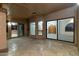 Covered patio space featuring tiled flooring and entry to the home at 10322 E Breathless Ave, Gold Canyon, AZ 85118