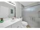 Bathroom featuring a white vanity, toilet, and shower with glass doors at 10350 W Deanne Dr, Sun City, AZ 85351