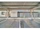 Covered carport with painted supports provides dedicated parking for residents and guests at 10350 W Deanne Dr, Sun City, AZ 85351