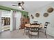 Inviting dining area featuring stylish decor, lots of light, and a ceiling fan for comfort at 10350 W Deanne Dr, Sun City, AZ 85351