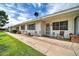 Welcoming home exterior with a lovely front patio, satellite dish, and well-kept lawn at 10350 W Deanne Dr, Sun City, AZ 85351