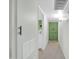 Hallway with green accent wall leading to other rooms at 10350 W Deanne Dr, Sun City, AZ 85351