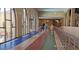 Bright, colorful hallway featuring large windows allowing for ample natural light and pleasant views at 10350 W Deanne Dr, Sun City, AZ 85351