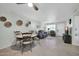 Bright and airy living room with natural light, laminate wood flooring, and comfortable seating at 10350 W Deanne Dr, Sun City, AZ 85351