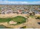 Aerial view of the home and community showcasing proximity to the golf course at 10453 W White Mountain Rd, Sun City, AZ 85351