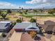 Aerial view of the home and community showcasing proximity to a golf course and scenic surroundings at 10453 W White Mountain Rd, Sun City, AZ 85351