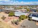 Aerial view of the community, featuring well-maintained homes, desert landscaping, and neighborhood streets at 10453 W White Mountain Rd, Sun City, AZ 85351