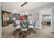 Elegant dining area with a glass table and unique chair design at 10453 W White Mountain Rd, Sun City, AZ 85351