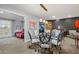 Stylish dining room with modern lighting, elegant table, and seating at 10453 W White Mountain Rd, Sun City, AZ 85351