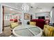 Bright dining area featuring a table with seating for four and open concept views of the living spaces at 10453 W White Mountain Rd, Sun City, AZ 85351