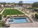 Aerial view of a backyard with a pool, putting green, playground, and plenty of space for fun at 11601 N 85Th St, Scottsdale, AZ 85260