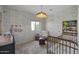 Charming Bedroom with patterned wallpaper, a cozy armchair, and a comfortable crib for peaceful nights at 11601 N 85Th St, Scottsdale, AZ 85260